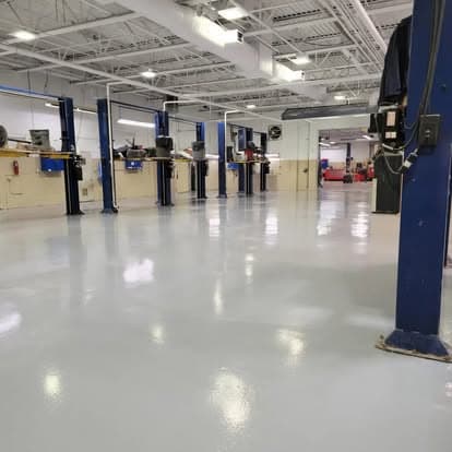 Auto dealership service bay — full-broadcast flake epoxy, Long Island NY