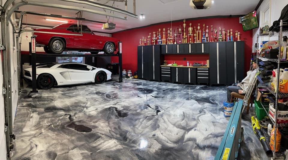 Metallic epoxy garage floor — black and white marble swirl with Lamborghini, Long Island NY